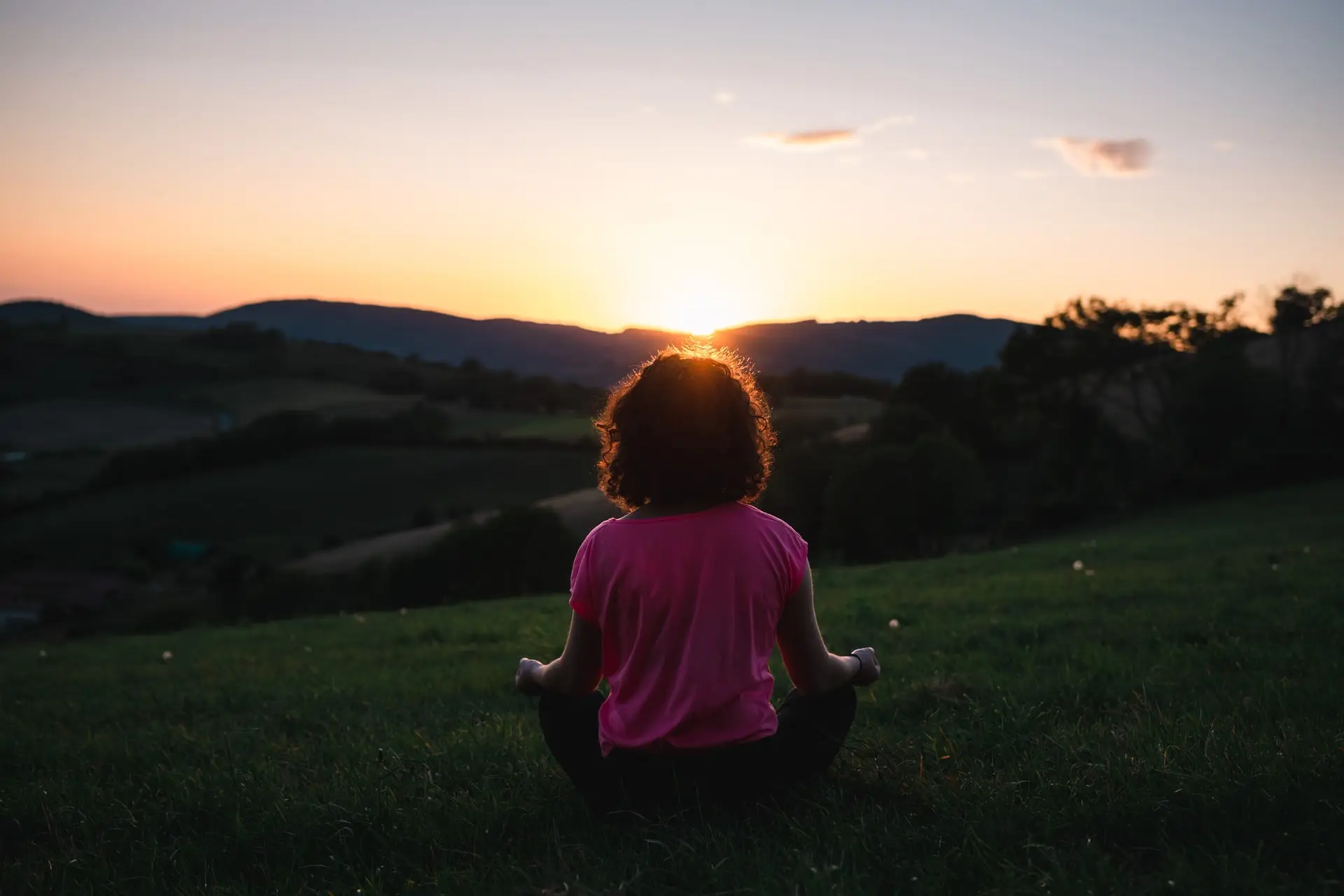 woman meditating outside